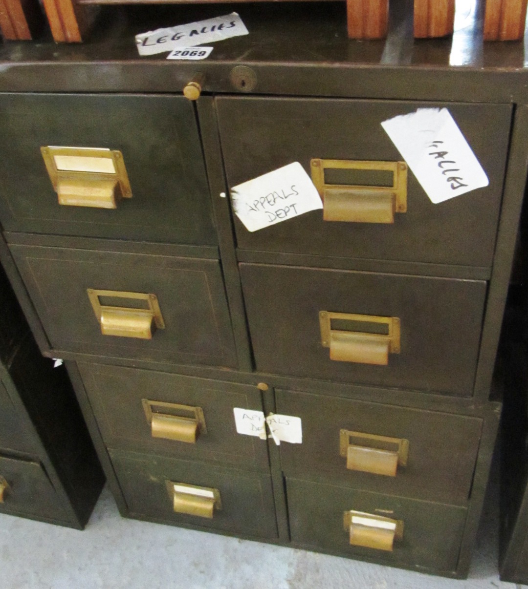 Appraisal: A similar pair of green painted metal four drawer filing