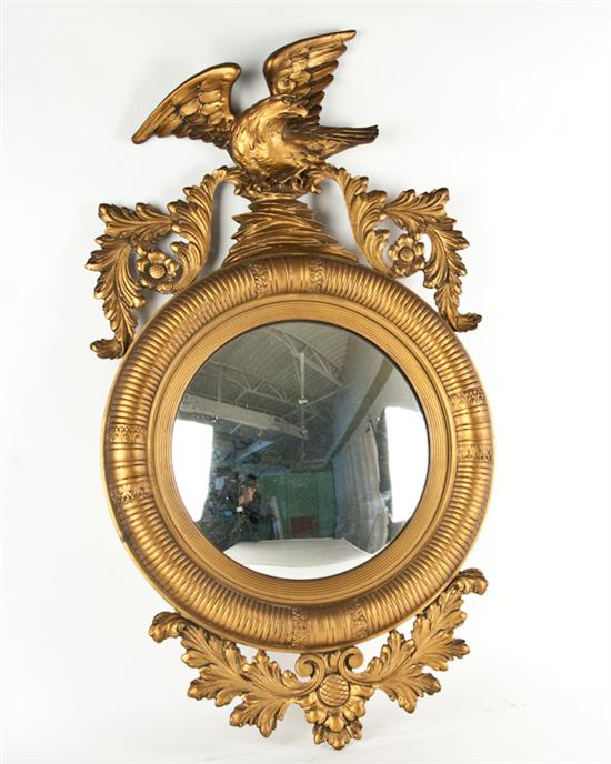 Appraisal: A Federal-style Gilt Wall Mirror with elaborate eagle carving to