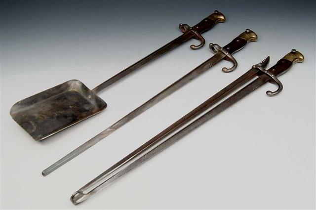 Appraisal: A SET OF THREE STEEL FIRE IRONS consisting of poker