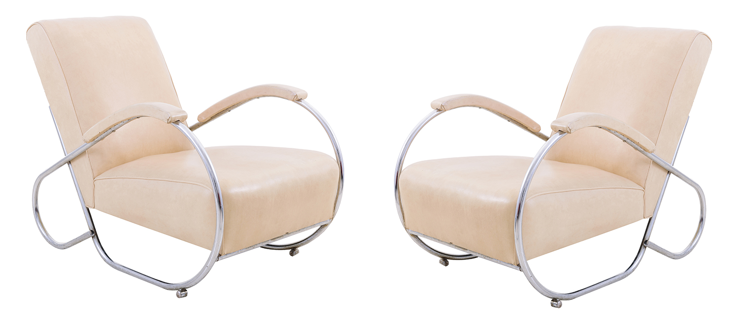 Appraisal: CANTILEVER MODERNIST STYLE PAIR OF CHAIRS Cream vinyl upholstery on