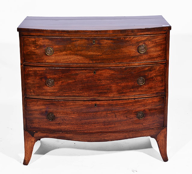 Appraisal: A GEORGE III MAHOGANY BOW FRONTED CHEST OF THREE LONG