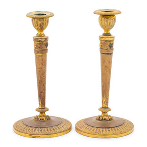 Appraisal: A Pair of Empire Style Gilt Metal Candlesticks Early th