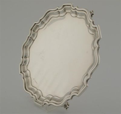 Appraisal: A modern salver with a shaped and moulded border and