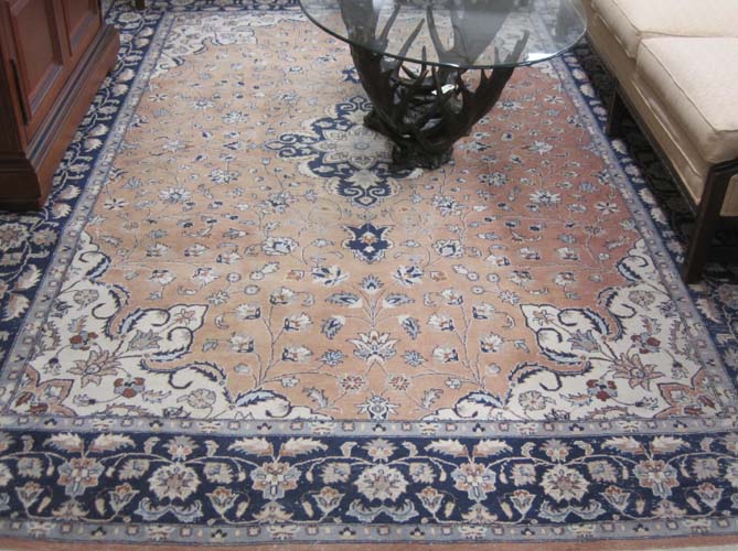 Appraisal: HAND KNOTTED ORIENTAL CARPET Pakistani-Persian floral and central floral medallion