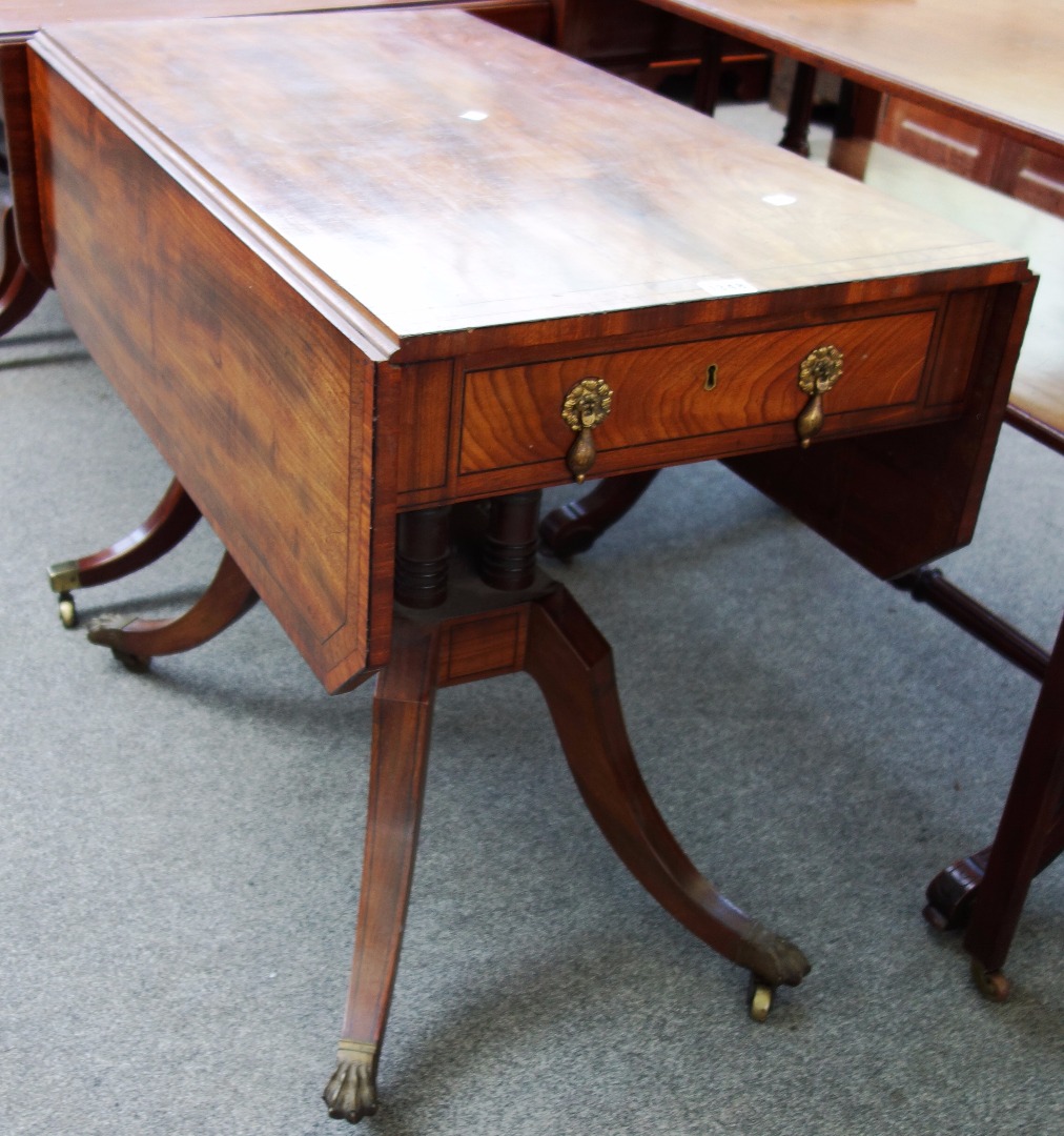 Appraisal: A George III mahogany drop flap centre table on four