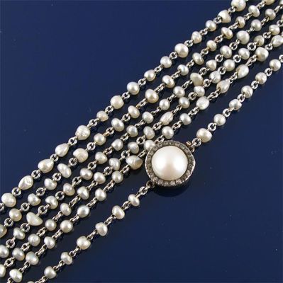 Appraisal: A long white gold neck chain set with seed pearls