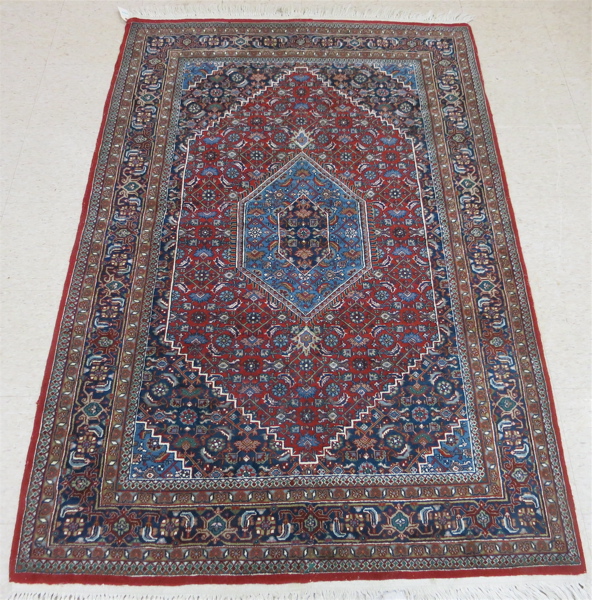 Appraisal: HAND KNOTTED ORIENTAL AREA RUG Indo-Bijar central geometric medallion and