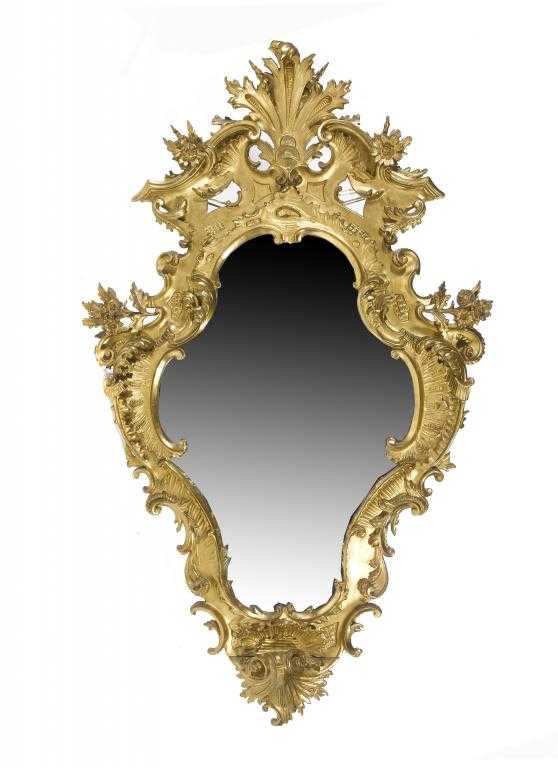 Appraisal: AN ITALIAN GILTWOOD MIRROR of cartouche shape the pierced cr