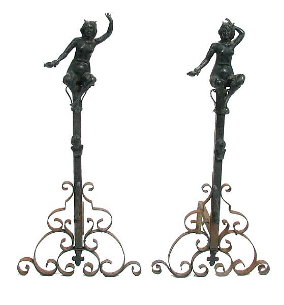 Appraisal: A pair of Spanish Baroque style andirons with figural finials