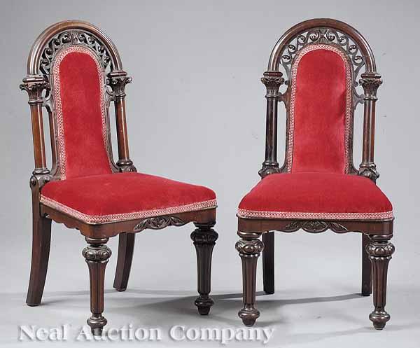 Appraisal: A Pair of English Gothic Revival Carved Mahogany Hall Chairs