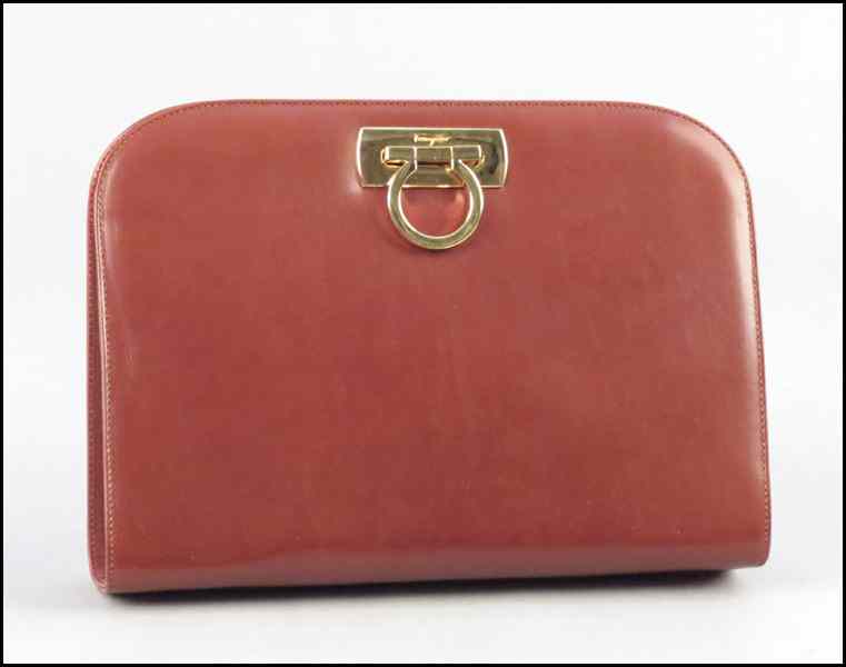 Appraisal: SALVATORE FERRAGAMO BROWN LEATHER CLUTCH HANDBAG With a retractable gold