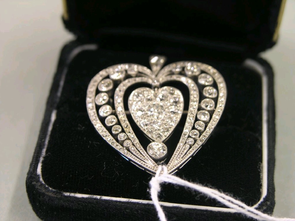 Appraisal: A platinum and diamond pendant-brooch in the form of an