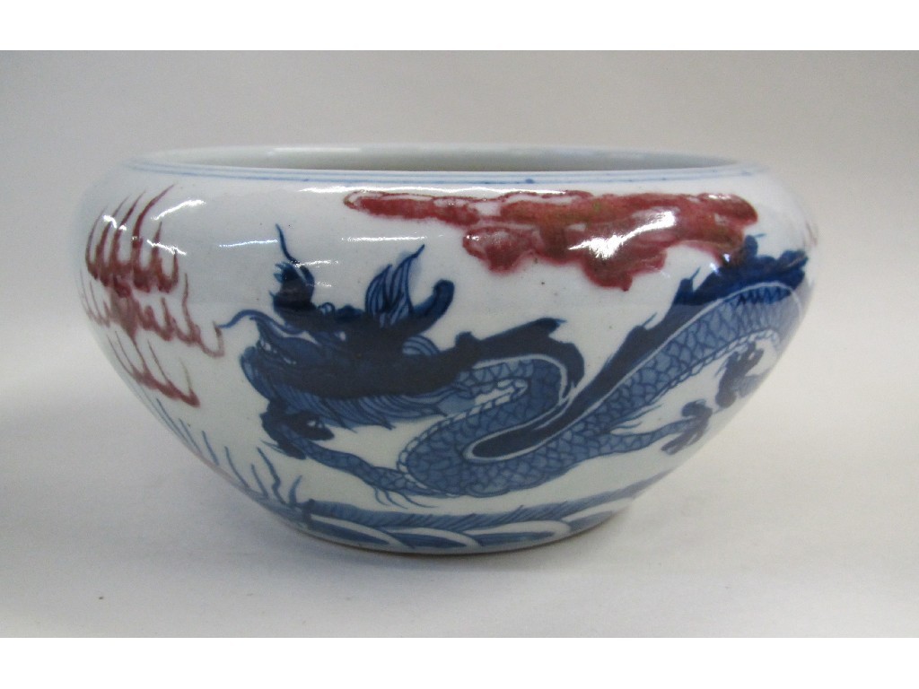 Appraisal: Chinese stoneware bowl decorated with dragons