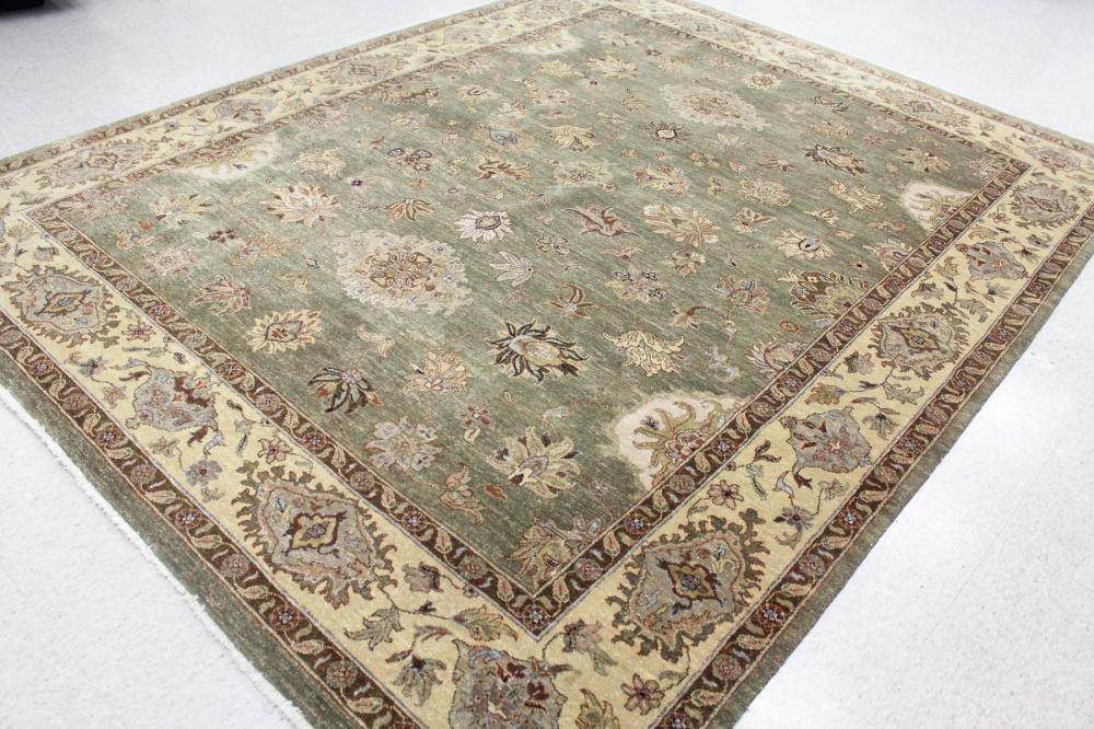 Appraisal: HAND KNOTTED ORIENTAL CARPET Indo-Persian floral design on green ground