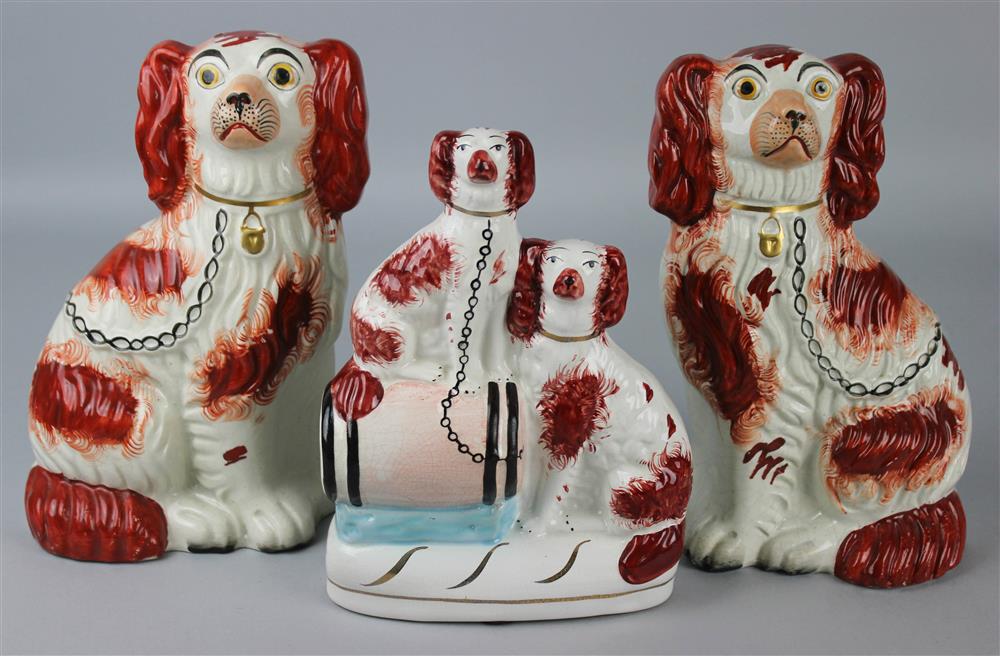 Appraisal: THREE STAFFORDSHIRE FIGURES OF SPANIELS LATE TH CENTURY including a