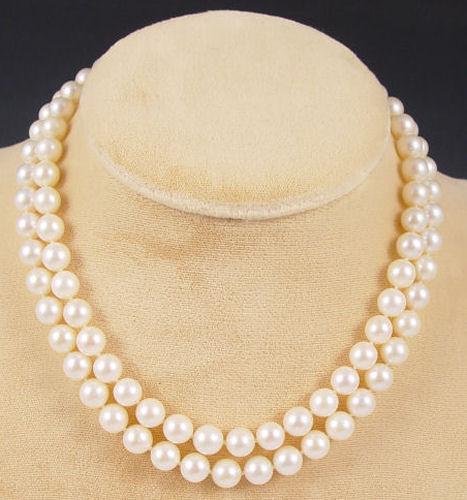 Appraisal: '' DOUBLE STRAND CULTURED PEARLS Double strand of - mm