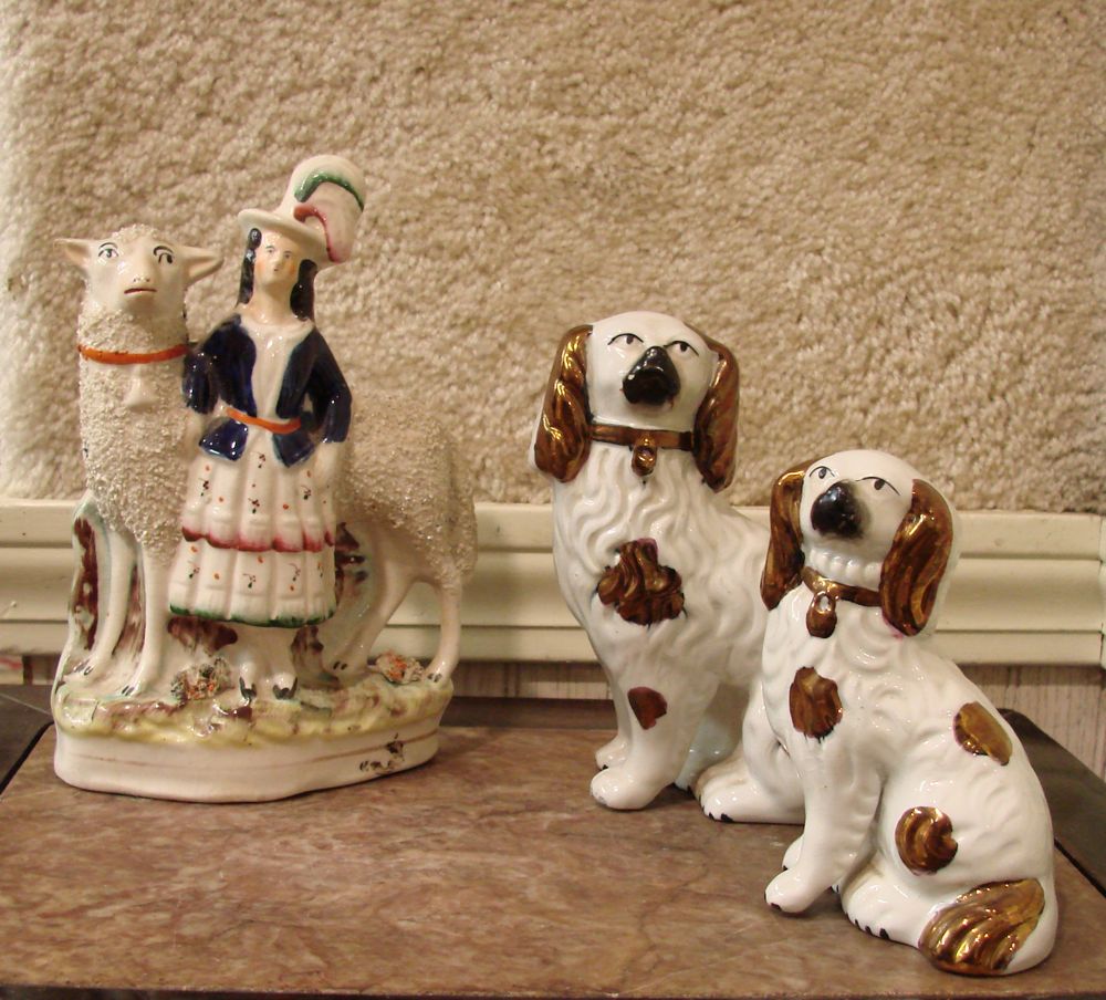 Appraisal: THREE PIECES OF ANTIQUE ENGLISH STAFFORDSHIRE th CenturyTwo dogs with