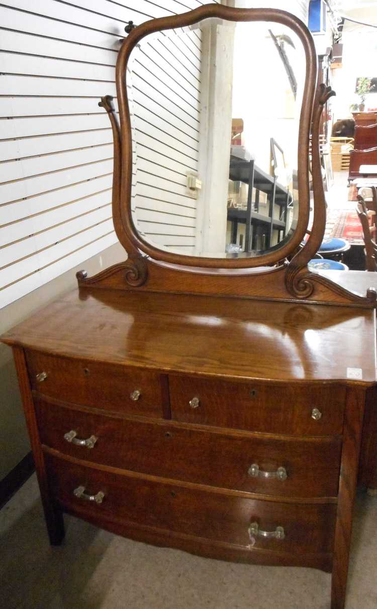 Appraisal: AN OAK BOW-FRONT DRESSER WITH TILT MIRROR American c with