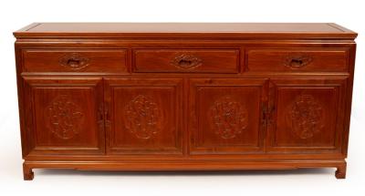 Appraisal: A Chinese hardwood sideboard fitted three drawers above cupboard doors