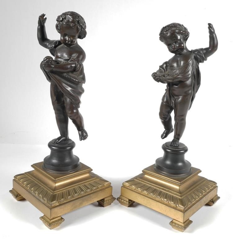 Appraisal: Pair of bronze cherubs with gilt metal base Partially nude