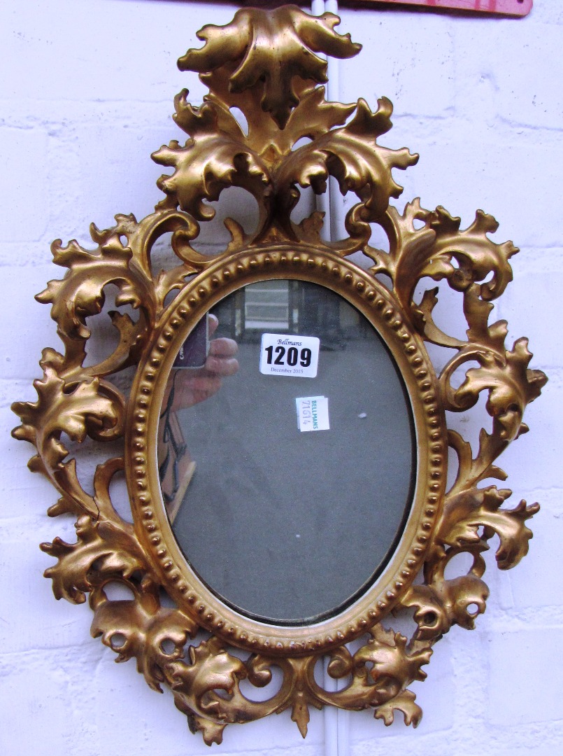 Appraisal: A small early th century oval gilt framed mirror with