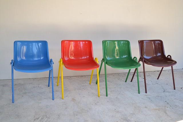 Appraisal: FOUR MULTI COLOURED PLASTIC TECNO 'MODUS' STACKING CHAIRS BY OSVALDO