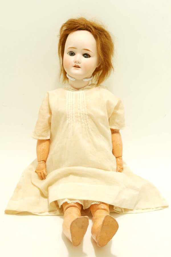 Appraisal: A Schoenau Hoffmeister child doll Bisque socket head with blue