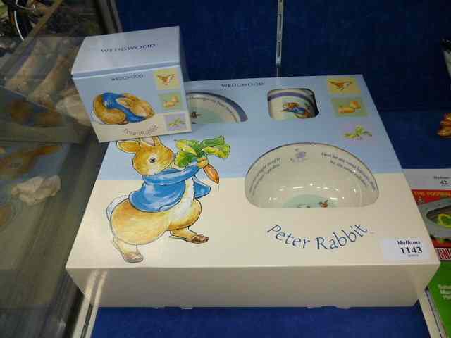 Appraisal: A WEDGWOOD 'Peter Rabbit' three piece mug bowl and plate