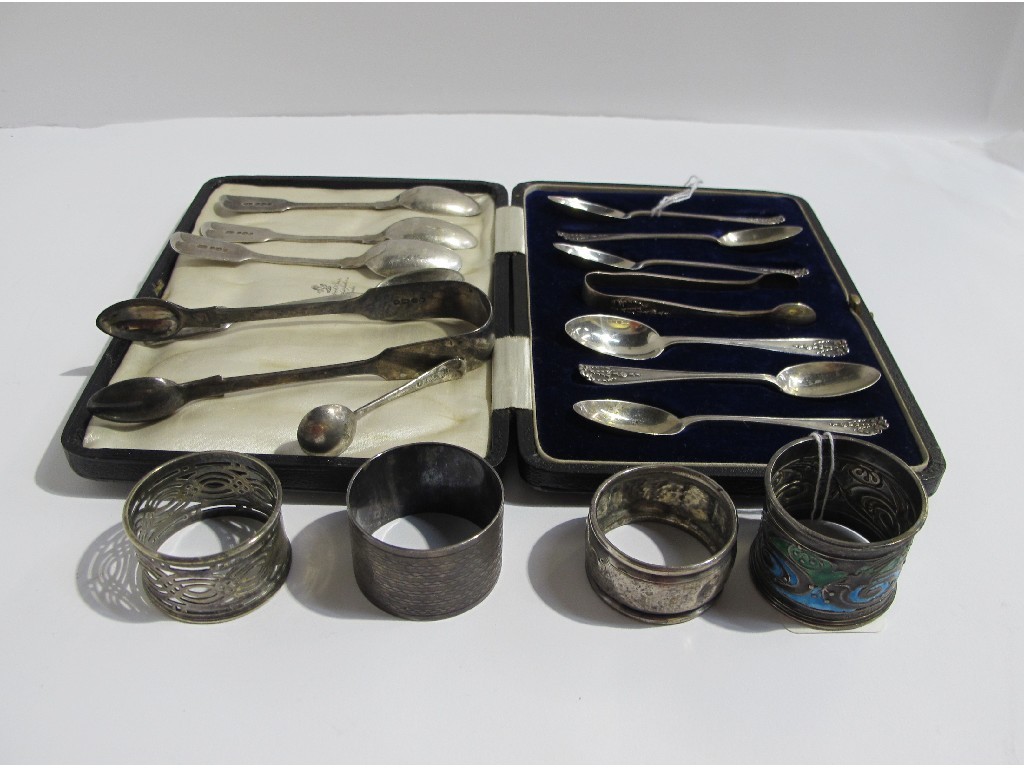 Appraisal: A lot comprising cased silver spoons with tongs napkin rings