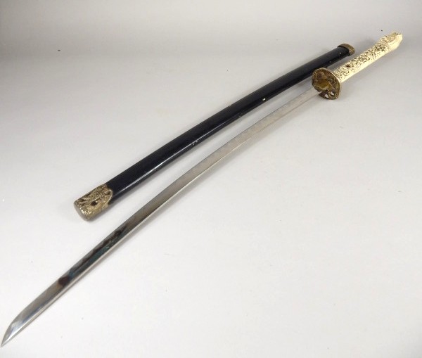 Appraisal: A reproduction Samurai sword with lacquer type scabbard ivorine handle