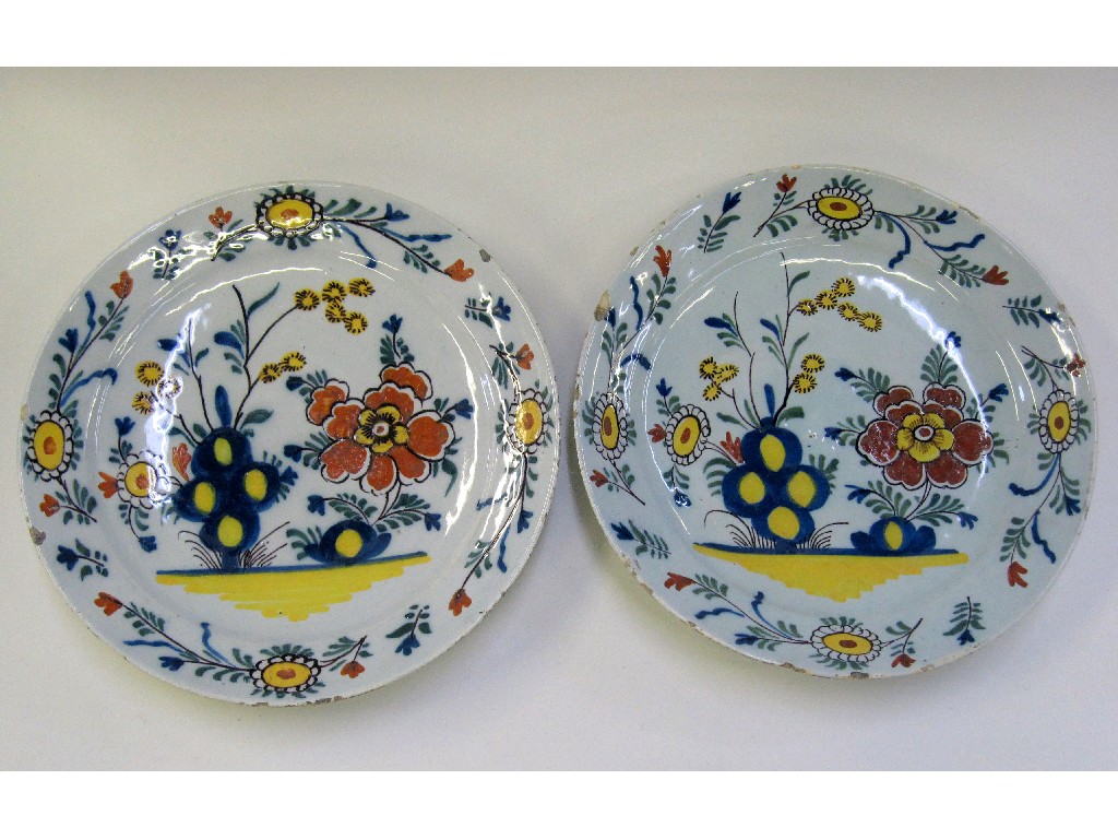 Appraisal: Pair of tin glazed plates decorated with flowers