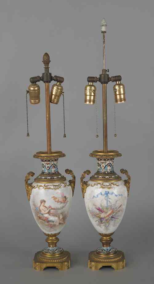 Appraisal: Pair of Sevres type porcelain lamps th c with cherub