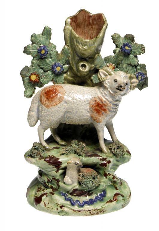 Appraisal: A WALTON PEARLWARE SHEEP AND LAMB SPILL HOLDER the animal