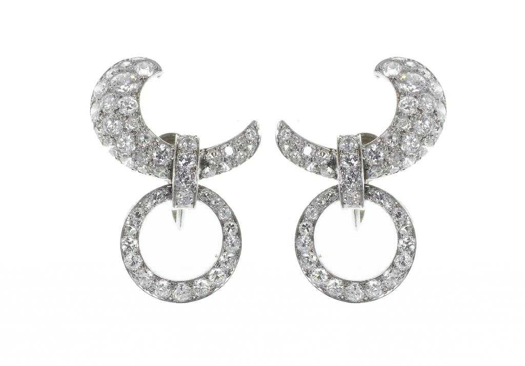 Appraisal: A PAIR OF CARTIER DIAMOND EARRINGS of crescent and hoop