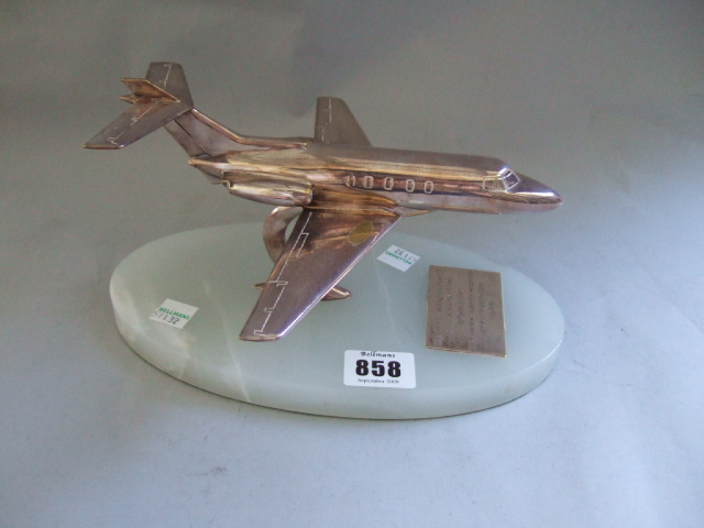 Appraisal: A silver plated model of a small passenger jet mounted