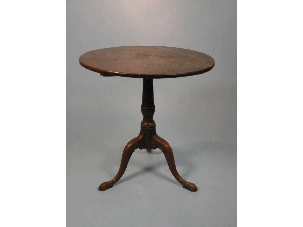 Appraisal: A George III mahogany tilt top table circular top on