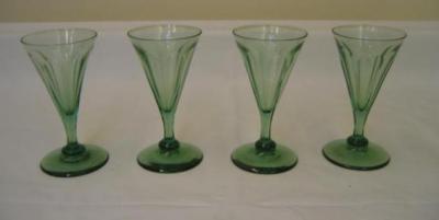 Appraisal: A SET OF TEN GREEN WINES with panelled conical bowl