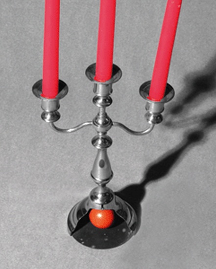 Appraisal: BILLIARD BALL CANDELABRA While the magician makes balls appear and