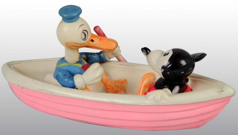 Appraisal: Celluloid Mickey Mouse Donald Duck In Boat Toy Description Japanese