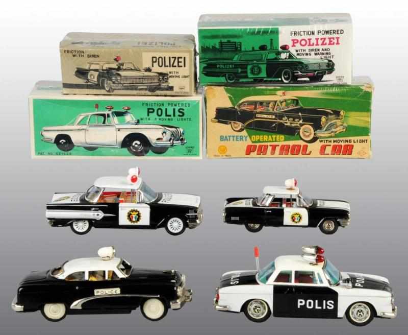 Appraisal: Lot of Tin Police Patrol Car Toys Description Japanese Working