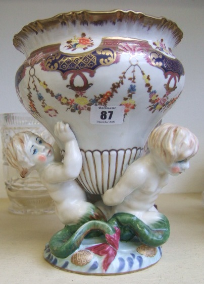 Appraisal: A continental porcelain centrepiece th century modelled as three sea