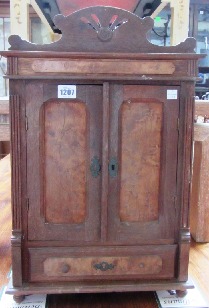 Appraisal: A miniature oak and birds eye maple two door armoire