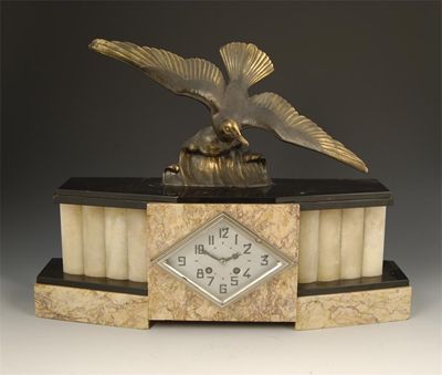 Appraisal: An Art Deco mantel clock silvered rhombus shaped dial with