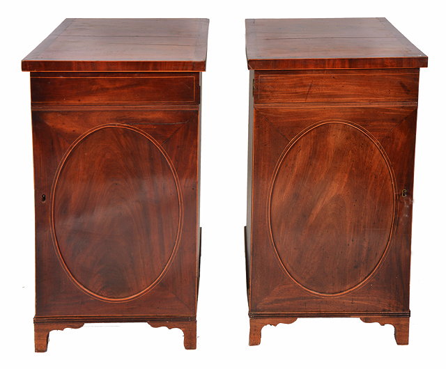 Appraisal: A PAIR OF REGENCY AND LATER MAHOGANY CABINETS with crossbanded