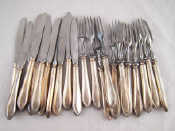 Appraisal: A fruit set of eleven knives and twelve forks with