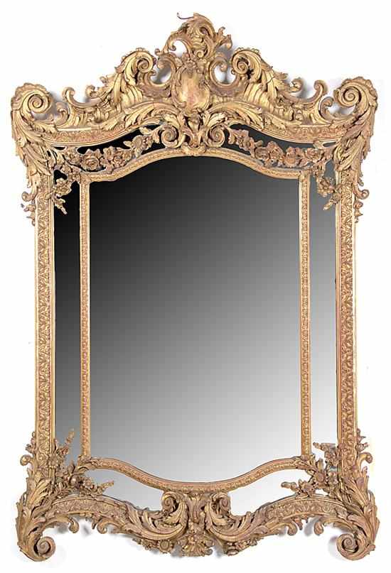 Appraisal: Rococo style giltwood mirror early th century shaped cornice with