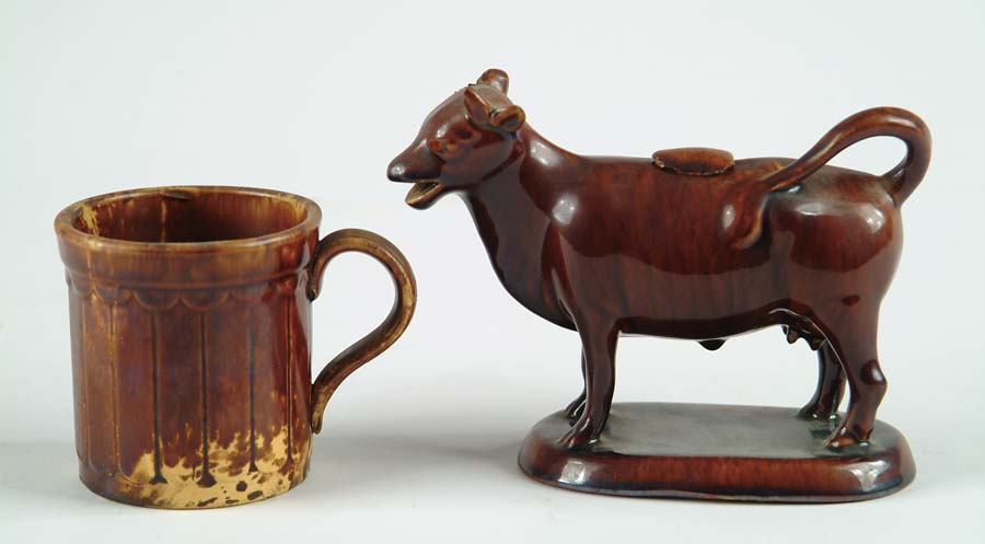 Appraisal: TWO PIECES OF ROCKINGHAMWARE Cow creamer unmarked on oval base