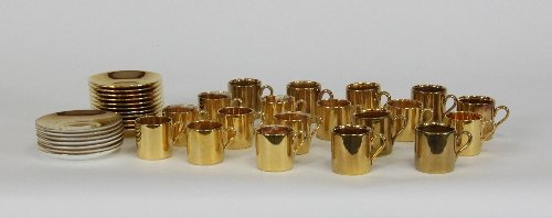 Appraisal: A quantity of Crown Devon coffee cans and saucers decorated