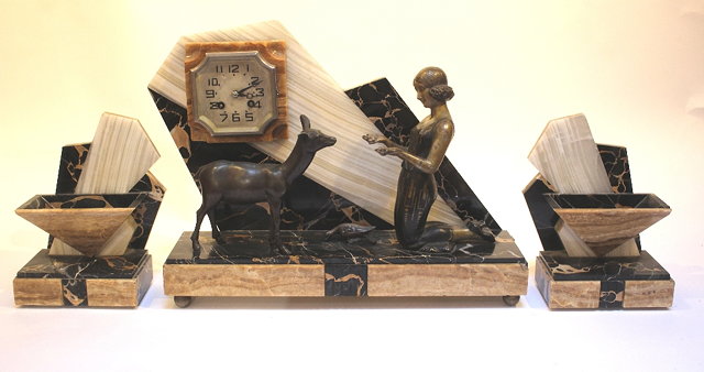 Appraisal: AN ART DECO MARBLE ONYX AND SPELTER THREE PIECE CLOCK