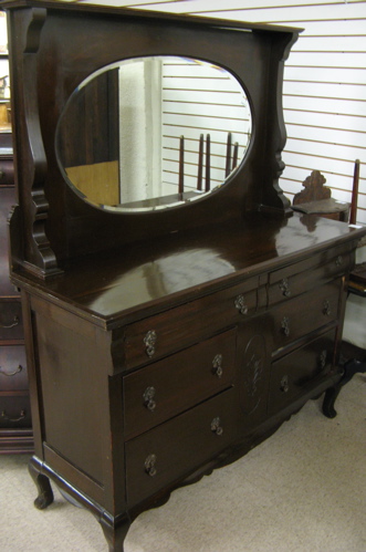 Appraisal: DARK MAHOGANY SIDEBOARD English early th century having an oval